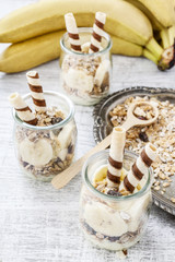 Poster - Layer dessert with muesli, chocolate and banana fruits.