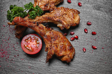 Wall Mural - Tasty grilled ribs on dark background