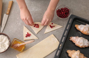 Wall Mural - Woman preparing puff pastry at table