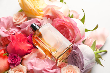 Wall Mural - Bottle of perfume on beautiful flowers