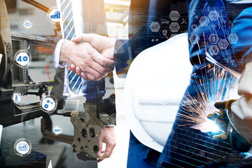 Wall Mural - Cyber communication and robotic trend , Industrial 4.0 Cyber Physical Systems technology concept. Double exposure of business men handshake teamwork , welding automate robot arm in smart factory