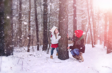 A winter fairy tale, a young mother and her daughter ride a sled