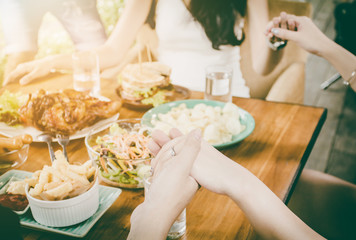 Top view.Group Of People Dining Concept.With  Chicken roasting,salad,French fries on wooden table