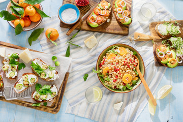 Bruschetta with tomatoes, cucumbers, Brussels sprouts, salad with chickpeas, quinoa