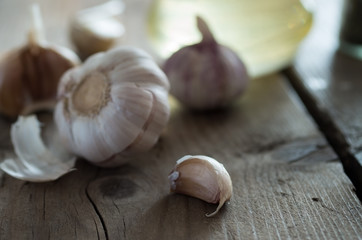 Wall Mural - Close up garlic on rustic wood table.