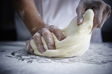 Wall Mural - Kneading bread dough