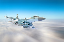 Military Fighter Aircraft At High Speed, Flying High In The Sky.
