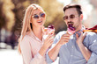 Romantic couple with ice cream in the city