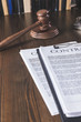 © LIGHTFIELD STUDIOS - juridical contract on wooden table with hammer , law concept