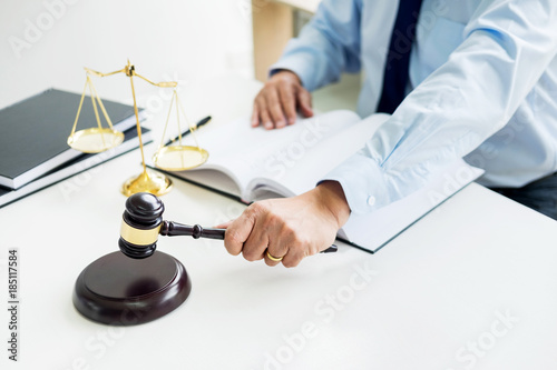 Fotografija gavel and soundblock of justice law and lawyer working on wooden desk background