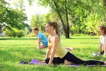 Sticker - Group of young people training in park