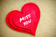 Heart with Miss you word isolated on a burlap fabric. Valentines Day and love concept