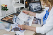 © LUMINA IMAGES - Hands of unrecognisable woman interior designer working with sketch at her office.