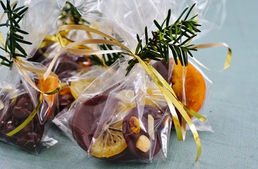 Wall Mural - Wrapping handmade chocolate candies in cellophane bags for the holidays 