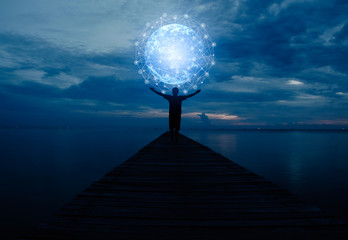 Abstract science, circle global network connection in hands on night sky background / soft focus picture / Blue tone concept