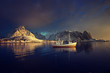 fishing boat and Reine Village, Lofoten Islands, Norway