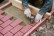 © Sergey Filimonov/Stocksy - Man puts paving