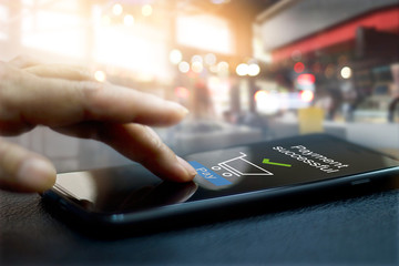 Aufkleber - Hand touching mobile screen of a Payment successful message on shopping mall background