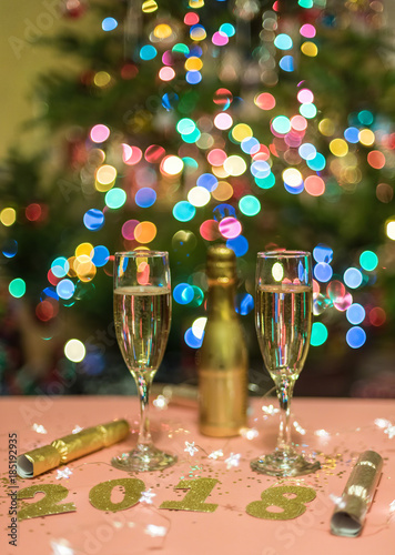 Champagne and party poppers for ringing in the new year Poster