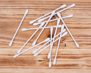 Wall Mural - Organic double end cotton ear and make up swabs, buds on wooden vintage background