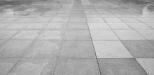 Perspective View Of Monotone Gray Brick Stone On The Ground For Street Road. Sidewalk, Driveway, Pavers, Pavement In Vintage Design Flooring Square Pattern Texture Background