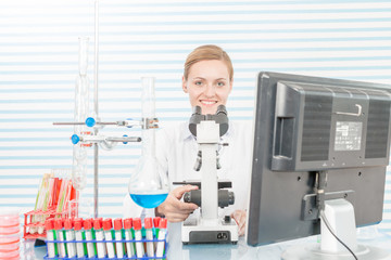 Poster - Experiments in the chemical laboratory, Female researcher using her test tube in a laboratory