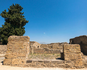 Walking around the ruins and the empty streets of the ancient antique site of Pompeii destroyed by Mount Vesuvius in AD 79, Naples, Campania, Italy, Europe