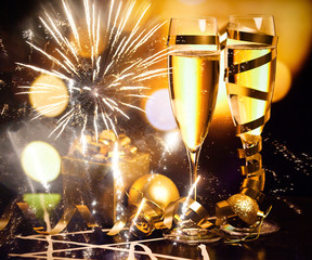 toasting with champagne glasses on sparkling holiday background - Fireworks at New Year and copy space