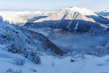 A Male Skier Is Riding In Fresh Powder Snow At Krippenstein In Austria.