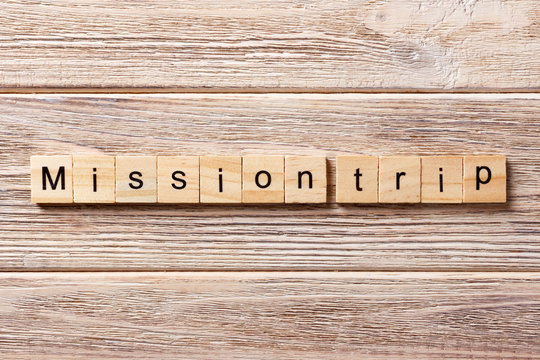 Mission Trip word written on wood block. Mission Trip text on table, concept