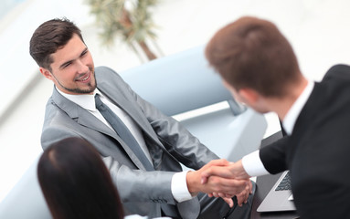 Sticker - handshake business partners in the lobby of the office.