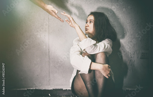 Fotografía Need Help, Depressed and frustrated, Supporter reaching hand to sad woman in the dark room, Mental health concept