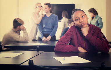 Wall Mural - sad girl student feeling uncomfortable at break between classes