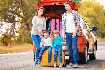 Sticker - Happy family with luggage near car. Traveling concept