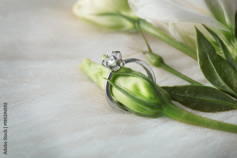 Luxury engagement on flower bud, closeup