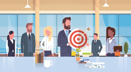 Poster - group of business people holding target teamwork and strategy concept mix race team in modern office