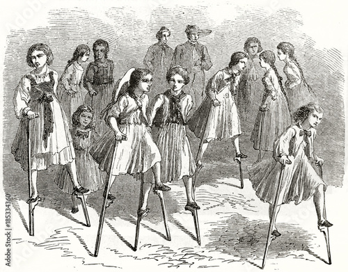 Fotografia, Obraz Old illustration of girls playing on stilts
