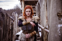 Viking Woman With Hammer In A Traditional Warrior Clothes.