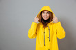 Portrait of a smiling girl dressed in raincoat