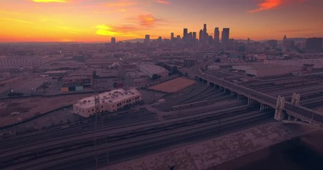 Aufkleber - Aerial view Los Angeles river downtown skyline in background at sunset 4K UHD