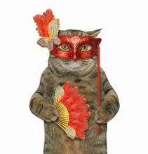 The Cat In A Red Masquerade Mask Is Holding A Feather Fan. White Background.