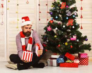 Wall Mural - Santa Claus with calm face on red garlands background.