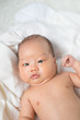 © akeeris - Asian new born baby boy smiling.