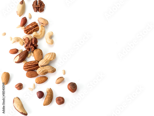 Fotomural Background of nuts - pecan, macadamia, walnut, almonds, hazelnuts, and other - with copy space