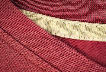 detail of a old pink cotton t-shirt