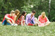 © yurolaitsalbert - group of happy students with books of the Park on a Sunny day