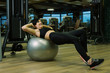 © mountaira - Woman doing fitball abs exercise