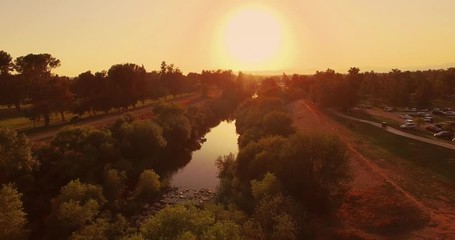 Aufkleber - Pan left over beautiful river landscape at sunset, aerial view. 4K UHD.
