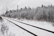  Snow-covered Train Tracks In The Suburbs