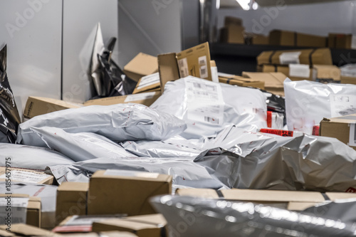 Fotografia  Huge amount of parcels and bags on conveyor